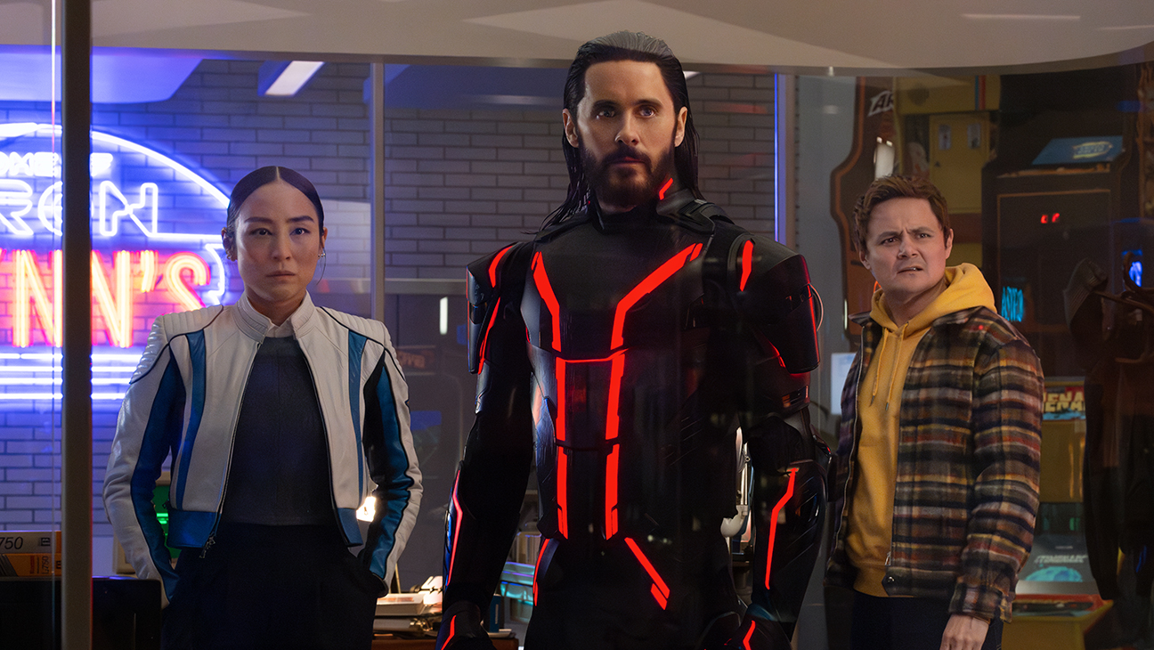 (L-R) Greta Lee as Eve Kim, Jared Leto as Ares, and Arturo Castro as Seth Flores in Tron: Ares
