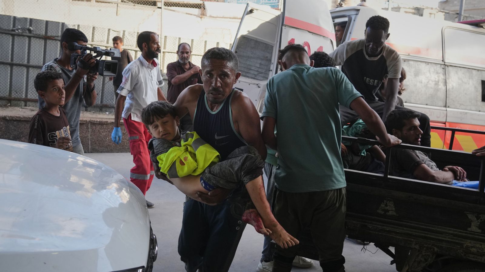 An injured child is carried to Nasser Hospital after an airstrike in Khan Younis. Pic: AP