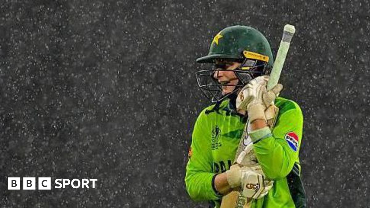 Pakistan batter Natalia Pervaiz holds her bat in the rain