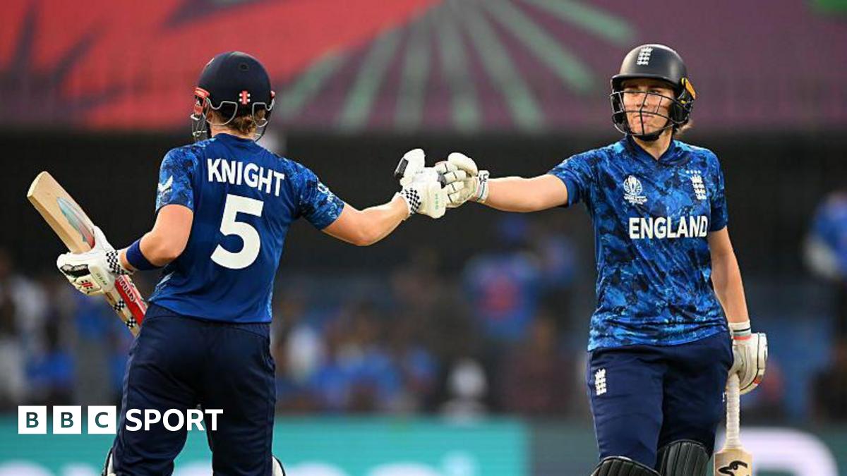 England batters Heather Knight and Nat Sciver-Brunt bump fists during their partnership of 113 against India at the Women's World Cup in Indore