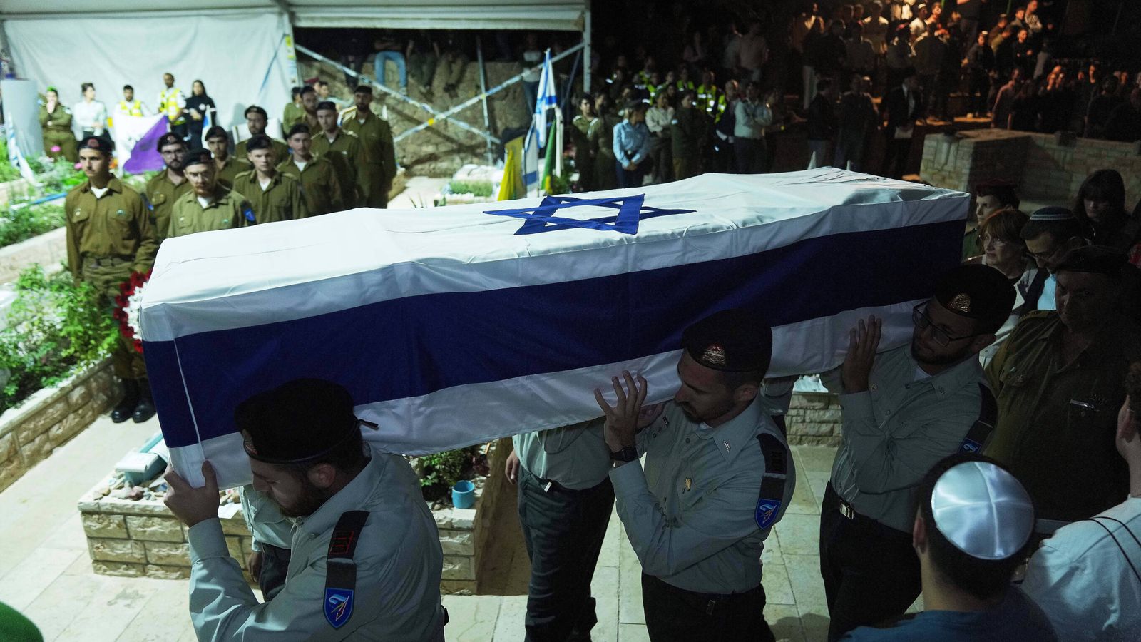 Israeli soldiers carry the coffin of hostage Captain Daniel Peretz. Pic: AP