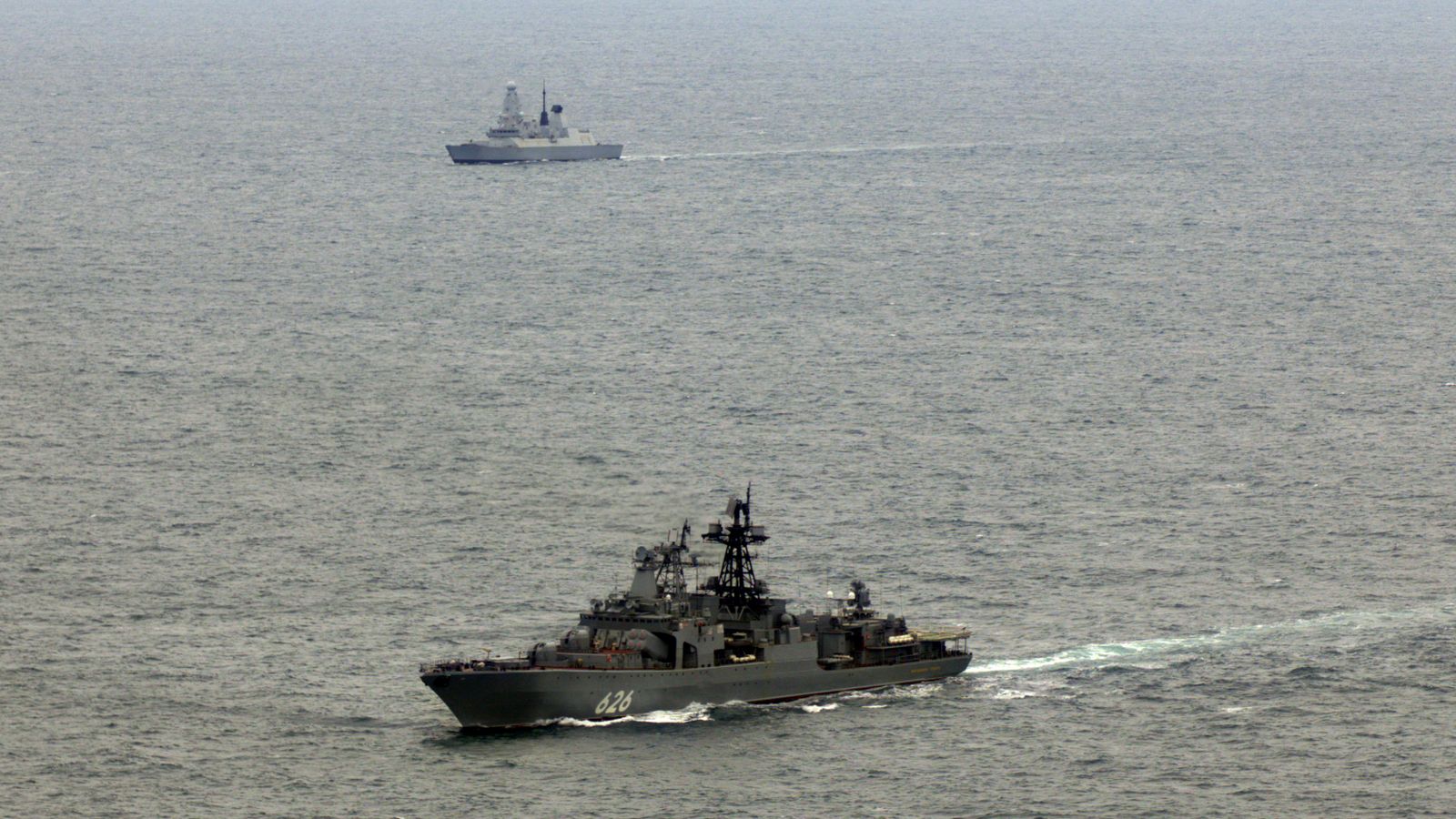 HMS Duncan (background) shadowing Russian destroyer Vice Admiral Kulakov (foreground). Pic: Royal Navy/MoD Crown Copyright/PA