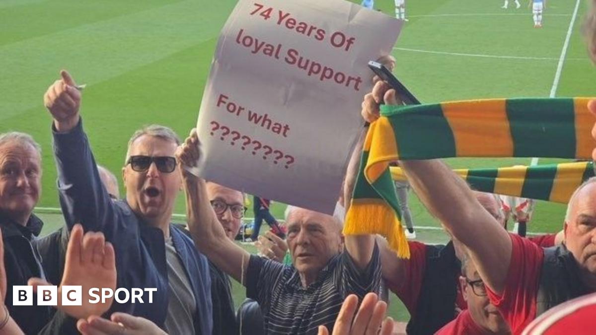 Manchester United supporter Michael Carney (centre) protesting  during  the 0-0 draw with Manchester City in April