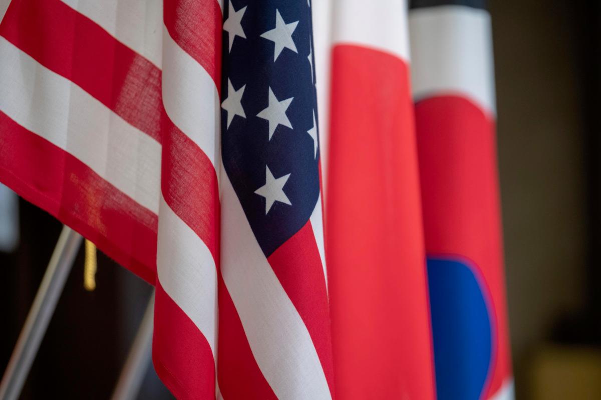 Flags representing the United States, Japan and the Republic of Korea