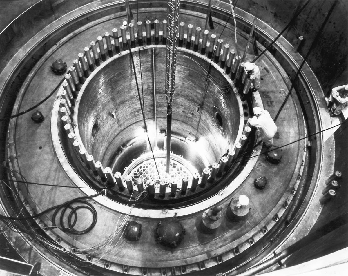 Engineers look inside a nuclear reactor.