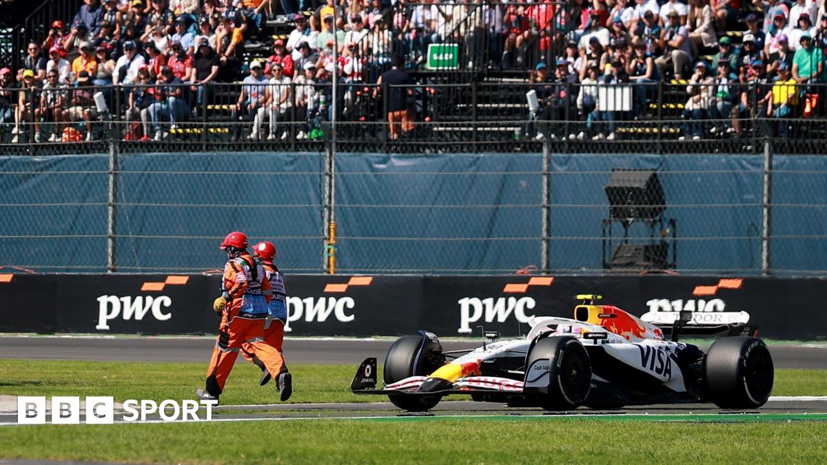 A marshal runs on the track during the Mexico City Grand Prix