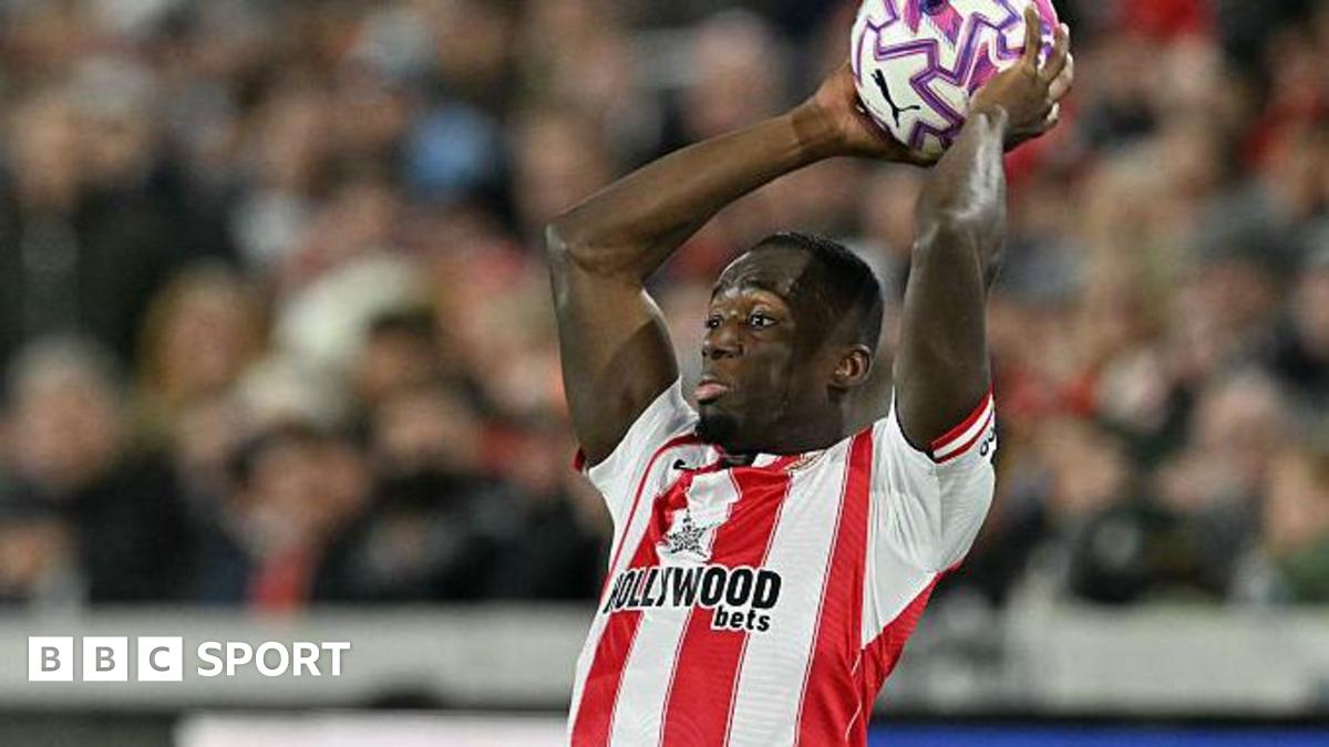 Michael Kayode takes a throw-in for Brentford