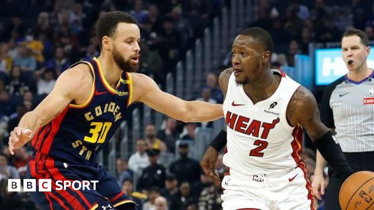 Shai Gilgeous-Alexander #2 of the Oklahoma City Thunder dribbles the ball while defended by Aaron Nesmith #23 of the Indiana Pacers