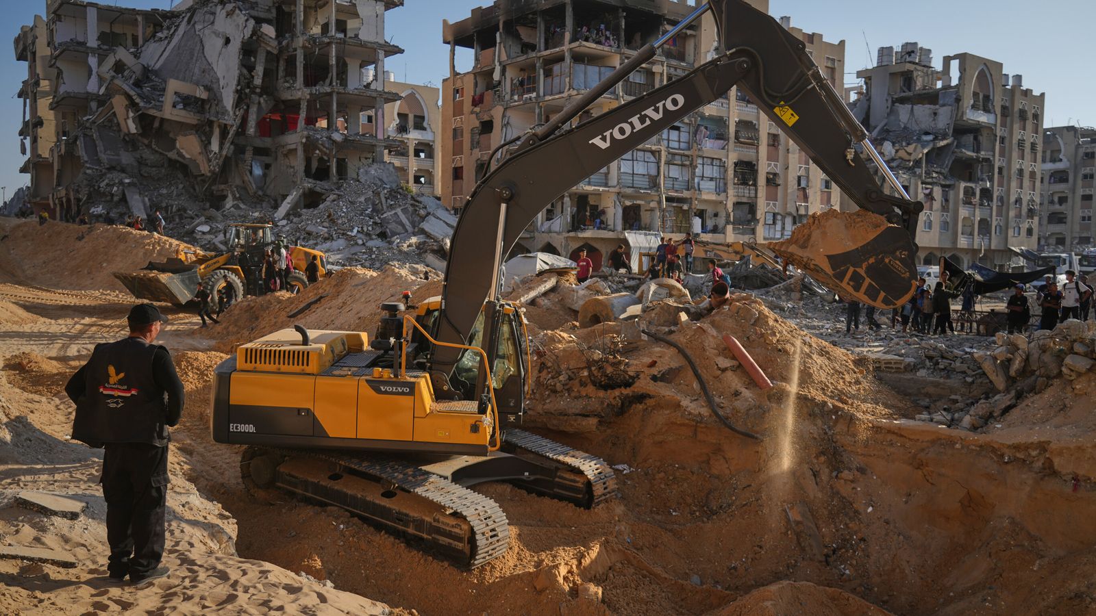 Teams using excavators in Khan Younis. Pic: AP