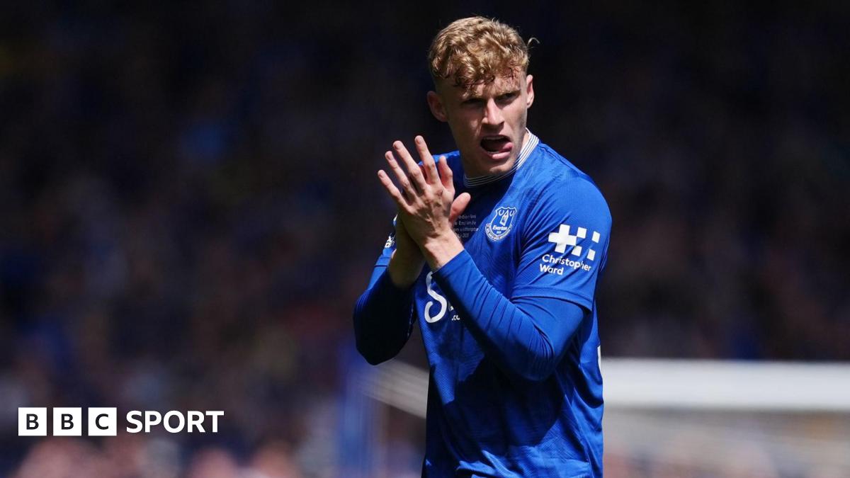 Jarrad Branthwaite applauding while wearing Everton's blue home shirt