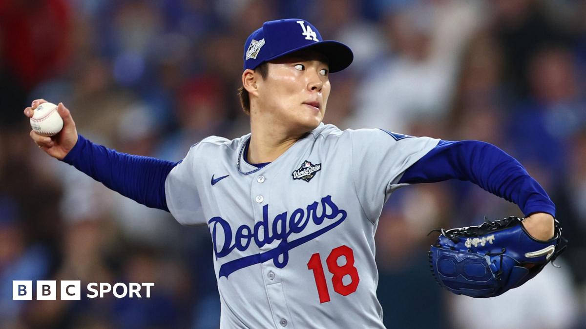 Los Angeles Dodgers pitcher Yoshinobu Yamamoto prepares to deliver a pitch