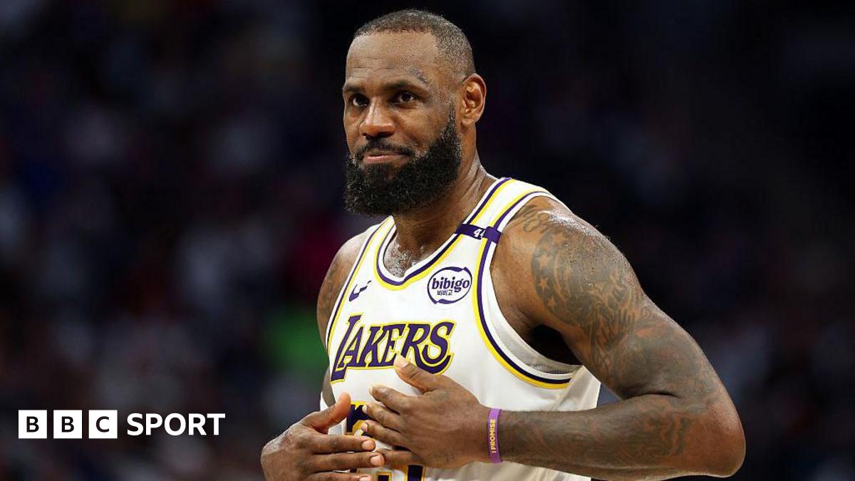 LeBron James holds his hands on his chest