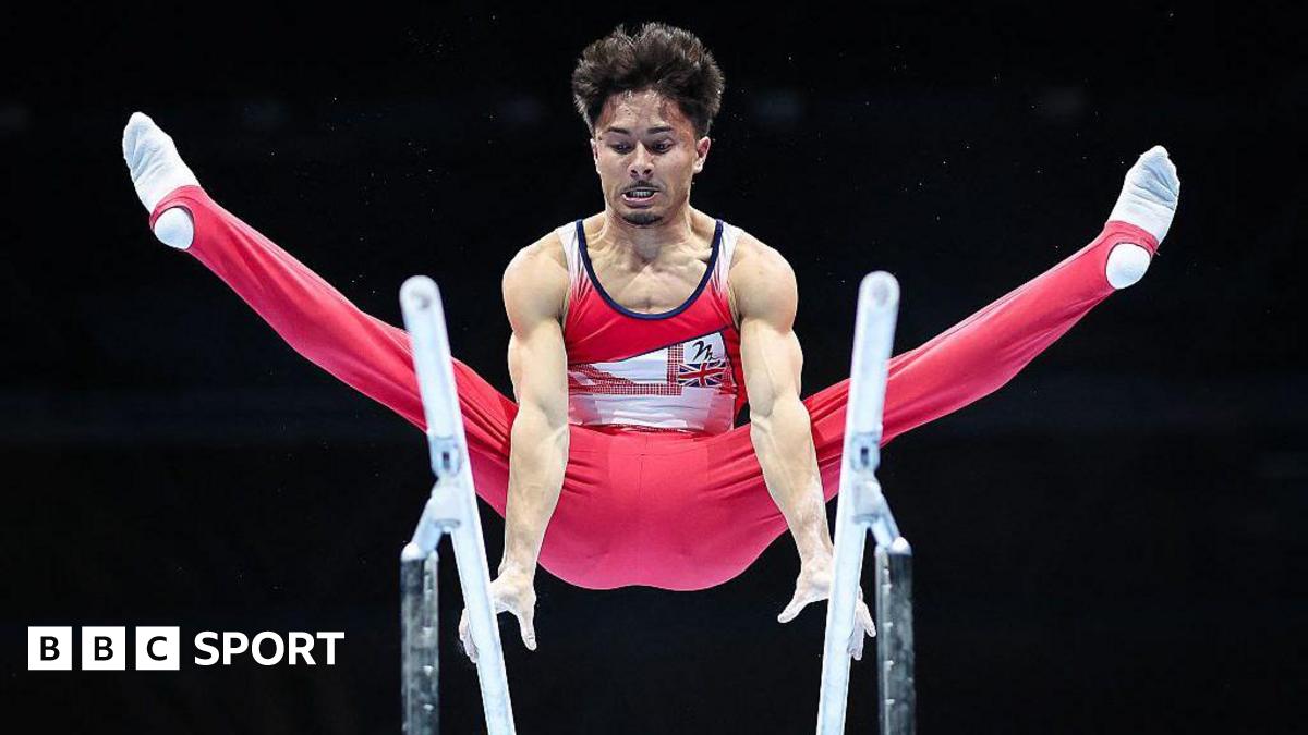 Jake Jarman performs on the parallel bars