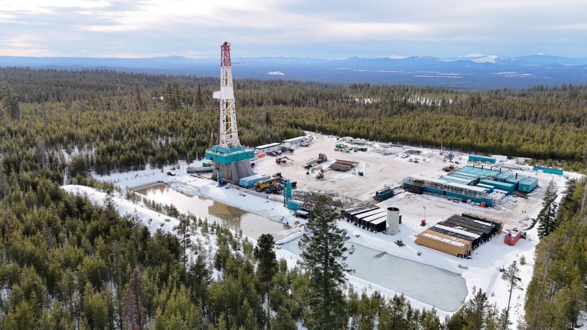 A geothermal drilling rig sits in a forest in Oregon.