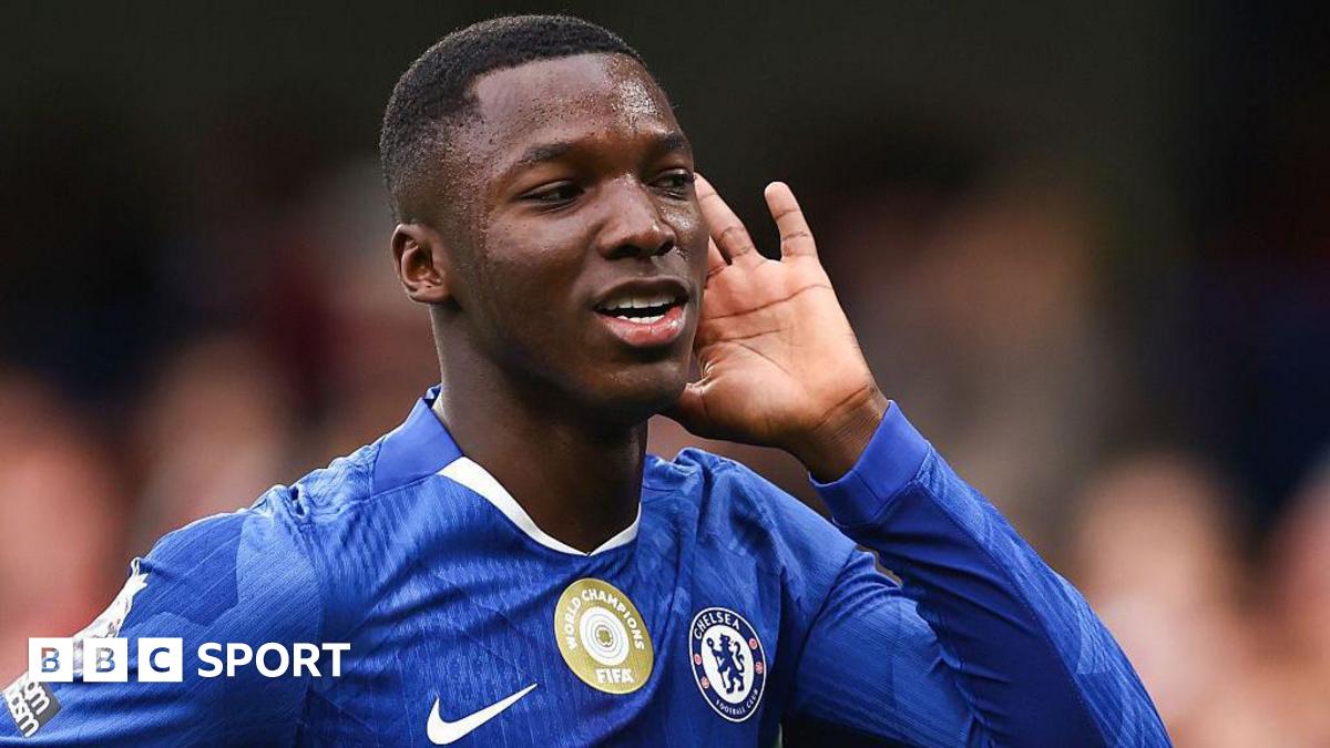 Moises Caicedo cups his hand to his ear to celebrate his goal against Liverpool