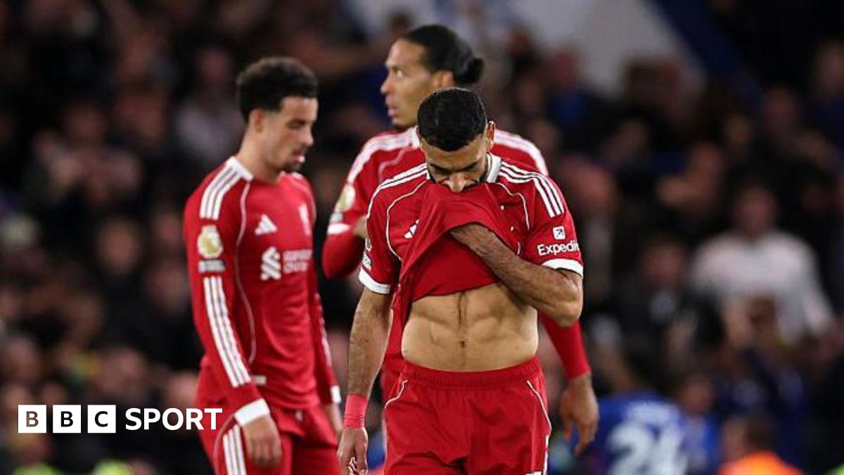 Liverpool players look disappointed after their loss to Chelsea