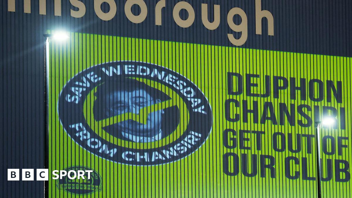 An image of former Sheffield Wednesday owner Dejphon Chansiri projected onto the side of Hillsborough by fans calling for him to go