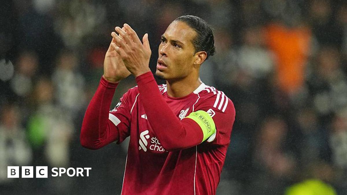 Virgil van Dijk applauds towards fans after a Champions League game