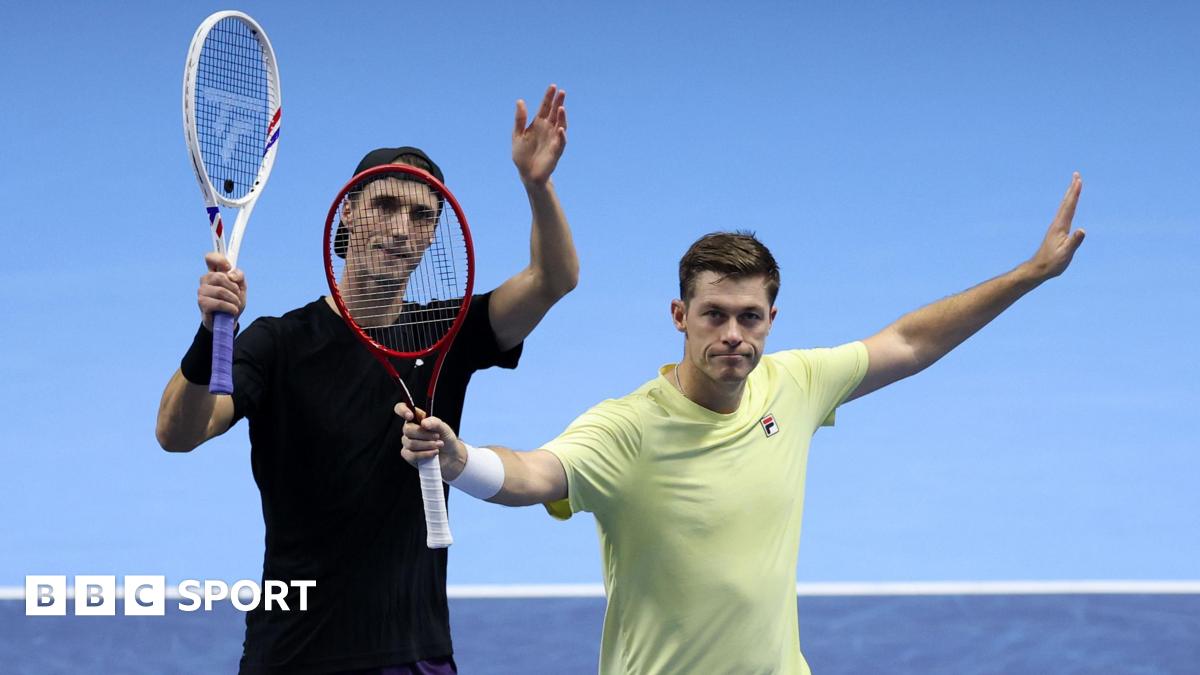 Joe Salisbury and Neal Skupski raise their racquets in celebration