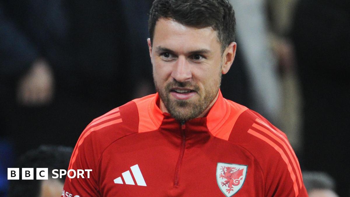Aaron Ramsey watches a Wales game from the stands