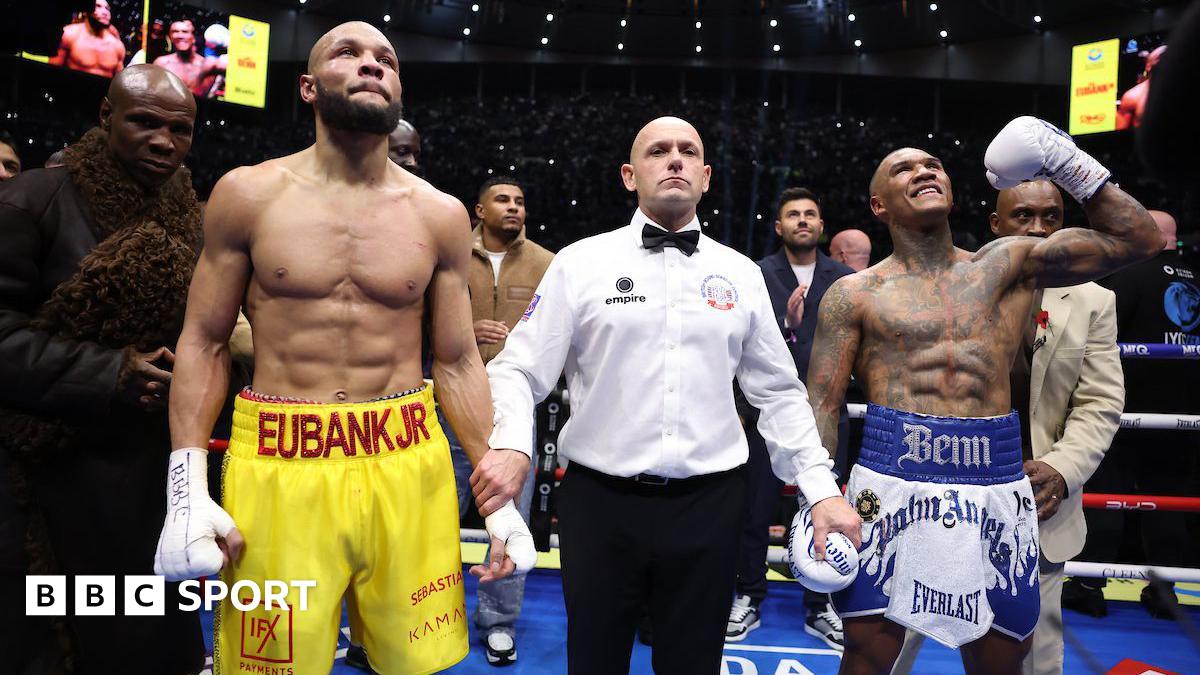 Conor Benn celebrates and Chris Eubank Jr looks up with the referee in the middle following the conclusion of their rematch