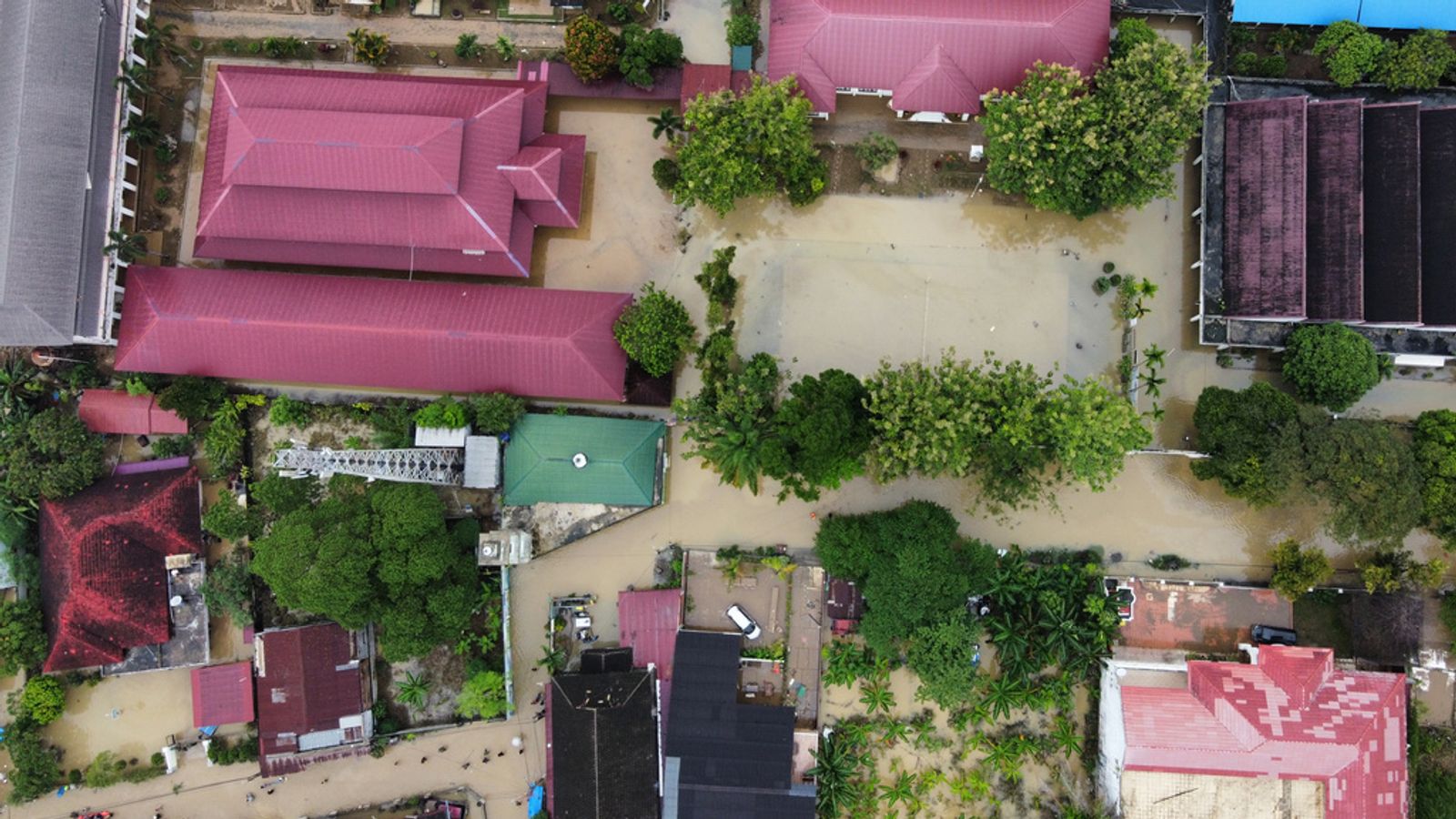 Flooded buildings in Medan, North Sumatra. Pic: AP/ Binsar Bakkara