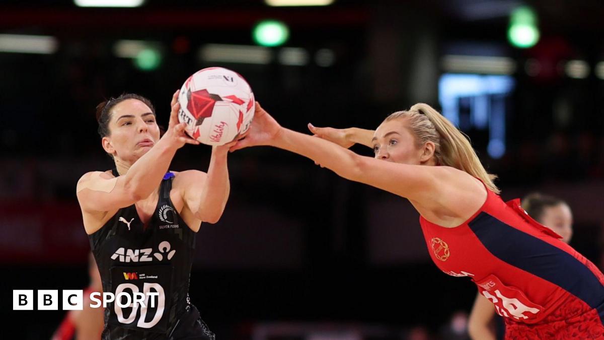 Helen Housby and Karin Burger go for the ball during England's match against New Zealand in Manchester