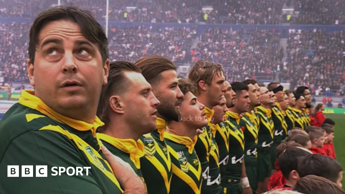 Australia team line up for the national anthem