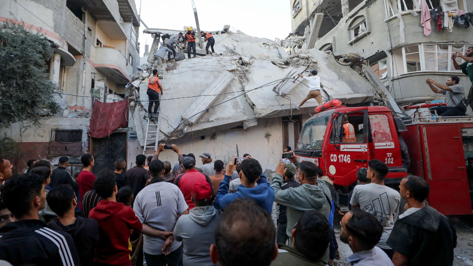 People gather following an Israeli airstrike in Gaza City. Pic: Reuters
