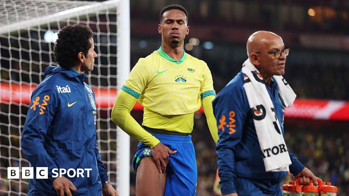 Gabriel walks off the pitch holding his right thigh