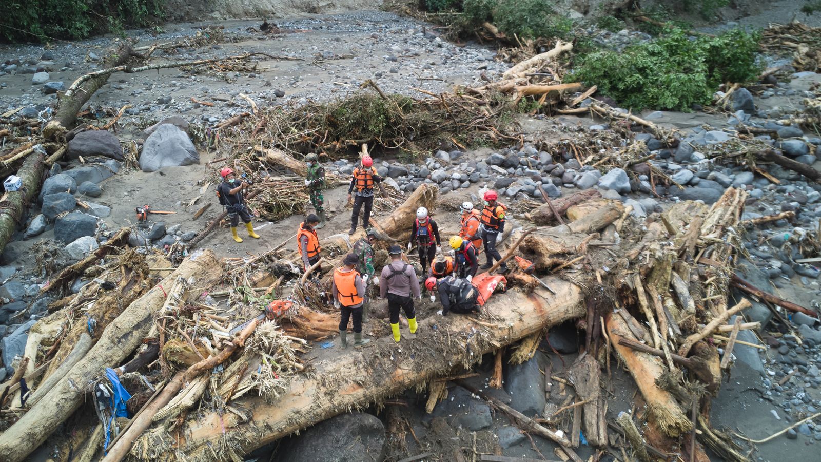 Rescuers search for flood victims in Tanah Datar, West Sumatra, Indonesia. Pic: AP
