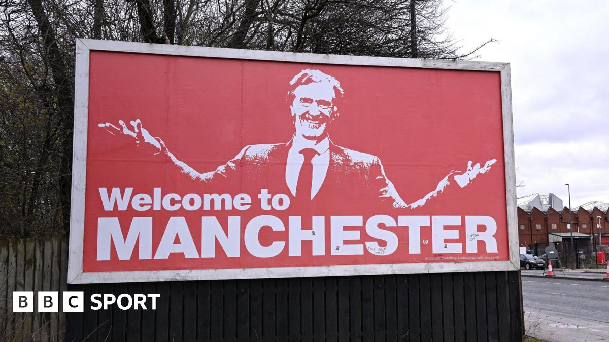 A billboard near Old Trafford featuring Sir Jim Ratcliffe and the words 'Welcome to Manchester'