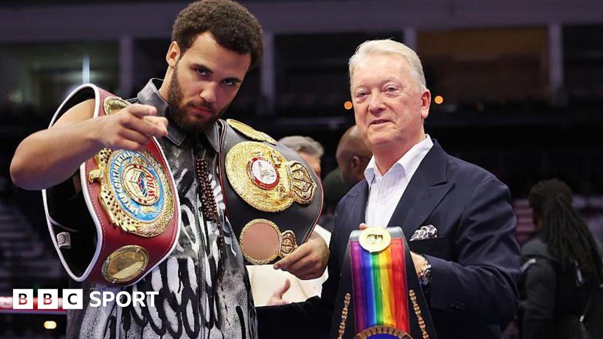 Moses Itauma poses with his belts beside Frank Warren