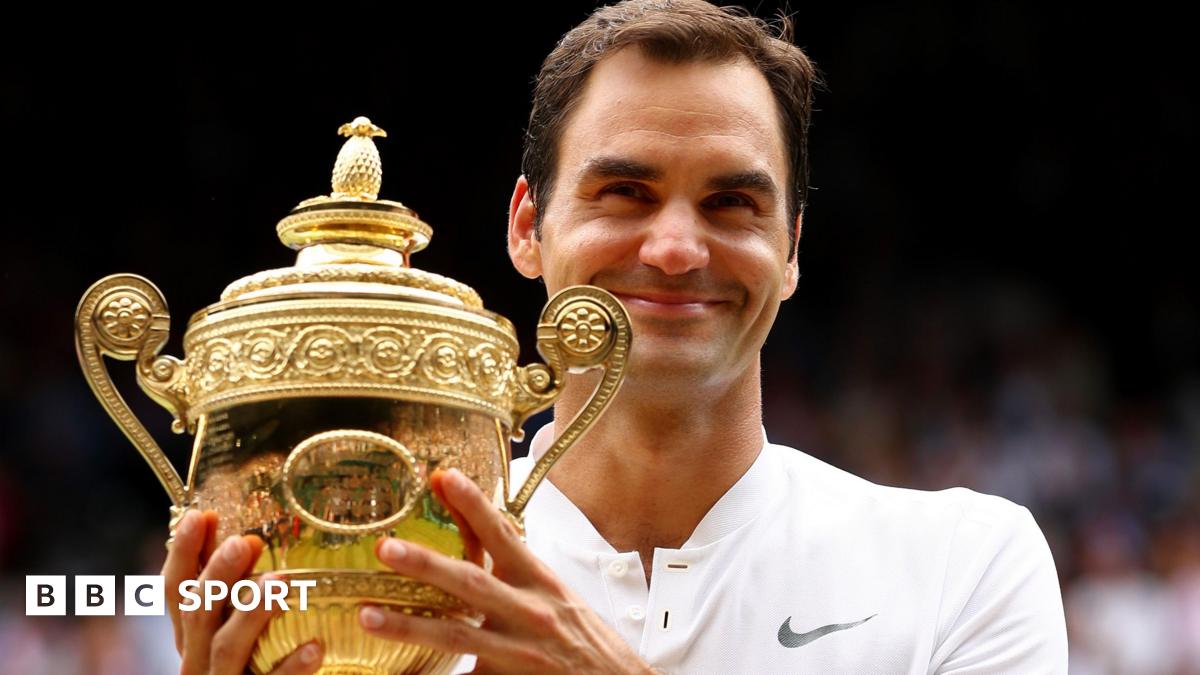 Roger Federer holds the Wimbledon men's singles trophy