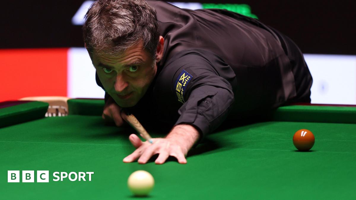 Ronnie O'Sullivan plays a shot