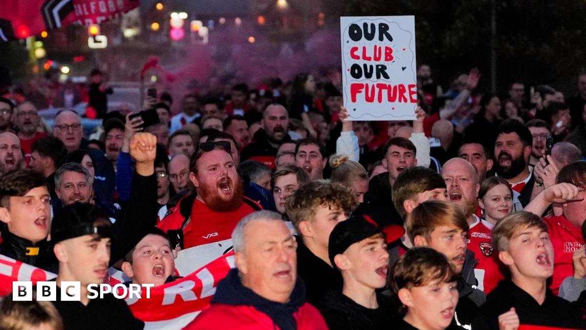 Salford Red Devils fans protest before their game against St Helens towards the end of the 2025 season
