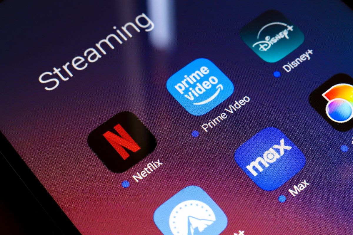 The streaming services Netflix, Amazon Prime Video, Disney Plus, Paramount Plus, Max, and Discovery Plus app appear on the screen of a smartphone