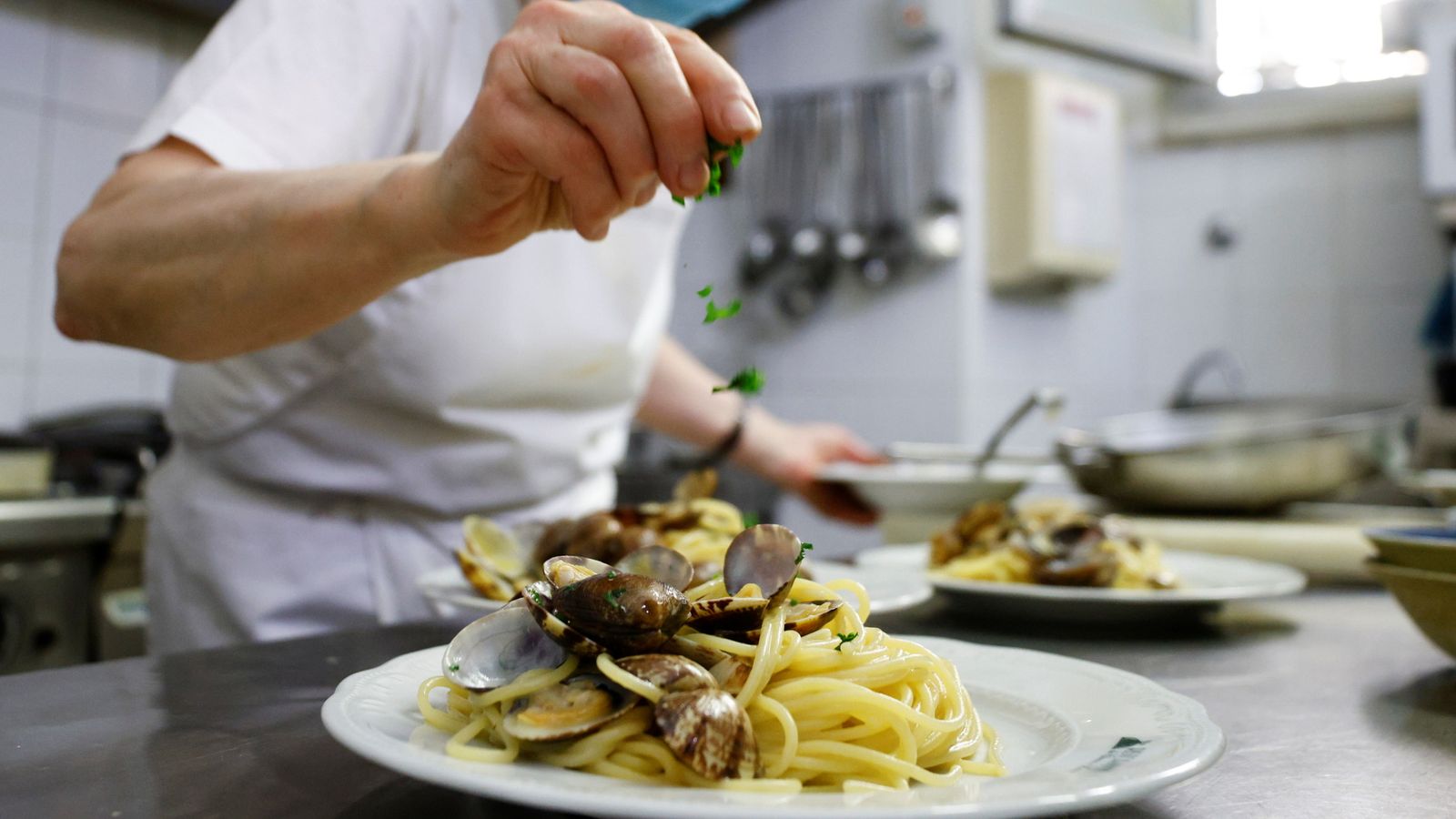 A chef prepares spaghetti alle vongole (spaghetti with clams) in Rome in 2021. File pic: Reuters