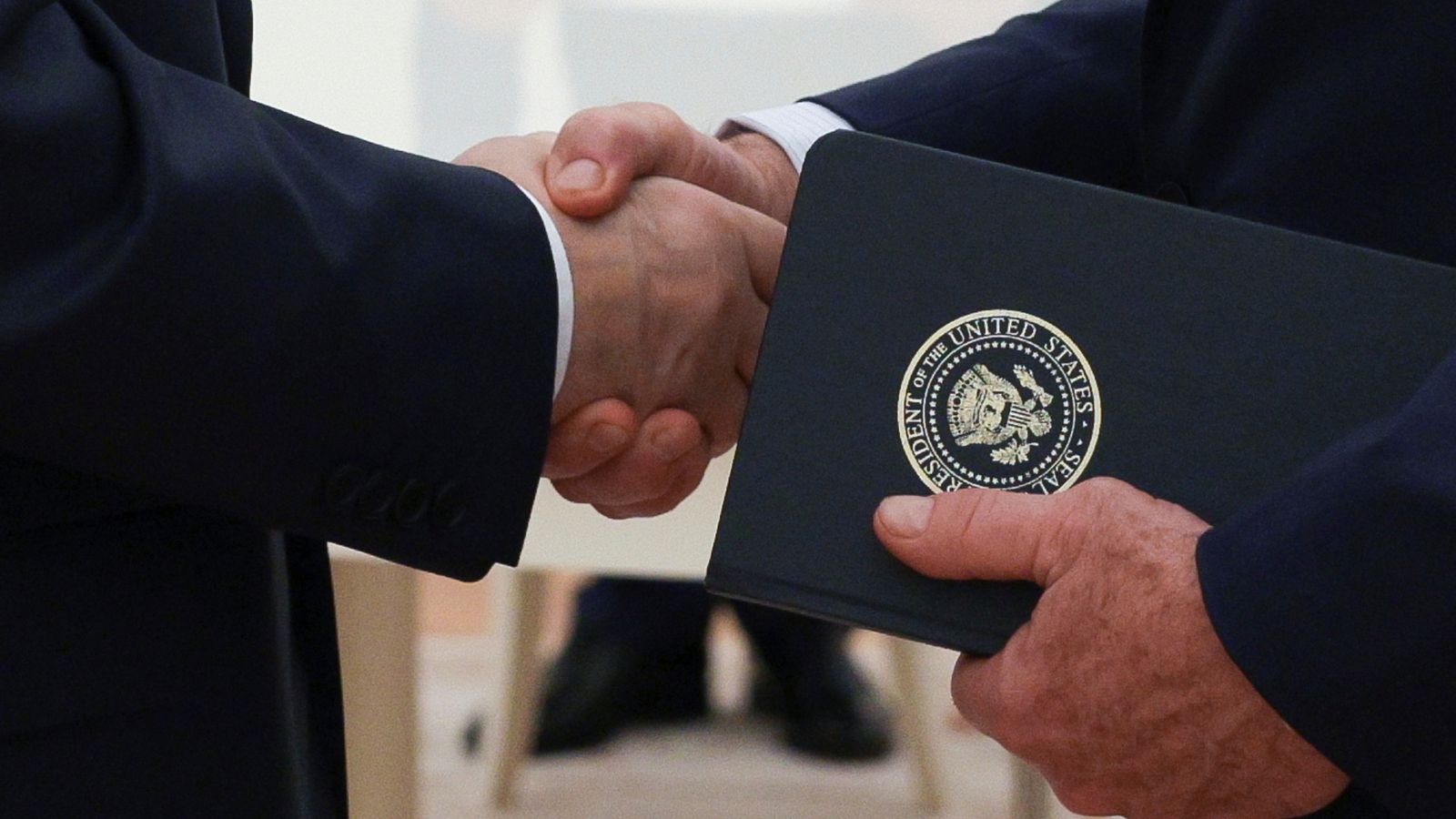 Vladimir Putin and Steve Witkoff shaking hands in August. AP file pic