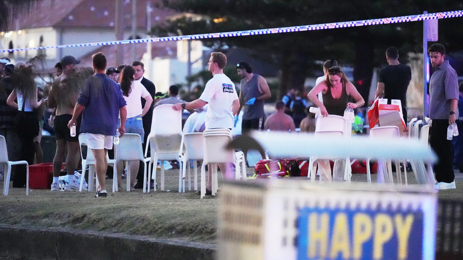 People and emergency workers after the incident on Bondi Beach. Pic: AP/Mark Baker