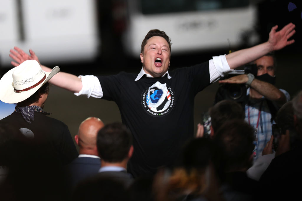 SpaceX founder Elon Musk celebrates after the successful launch of the SpaceX Falcon 9 rocket with the manned Crew Dragon spacecraft at the Kennedy Space Center on May 30, 2020