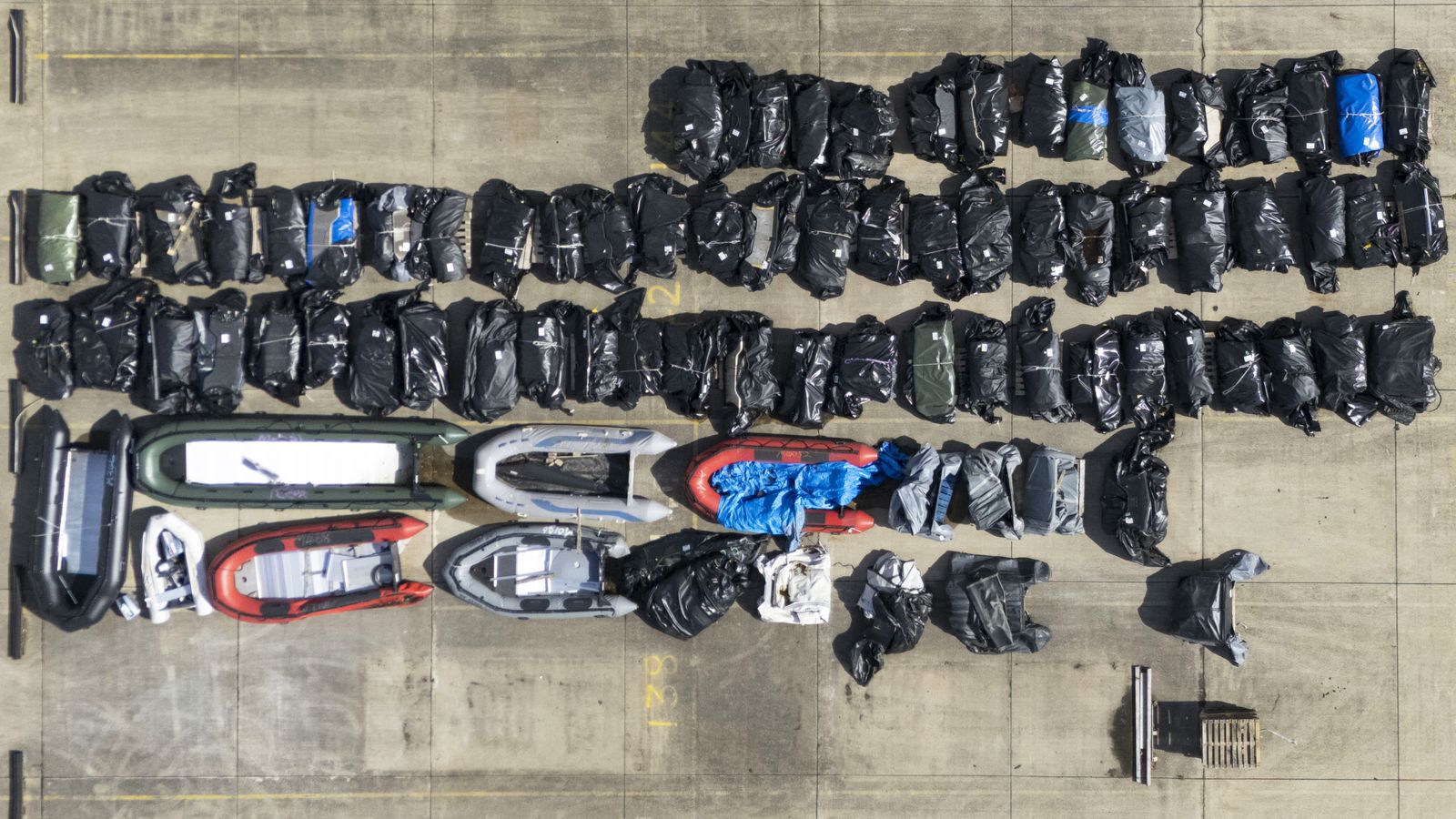 A view of small boats and outboard motors used by people thought to be migrants to cross the Channel from France. File Pic: PA