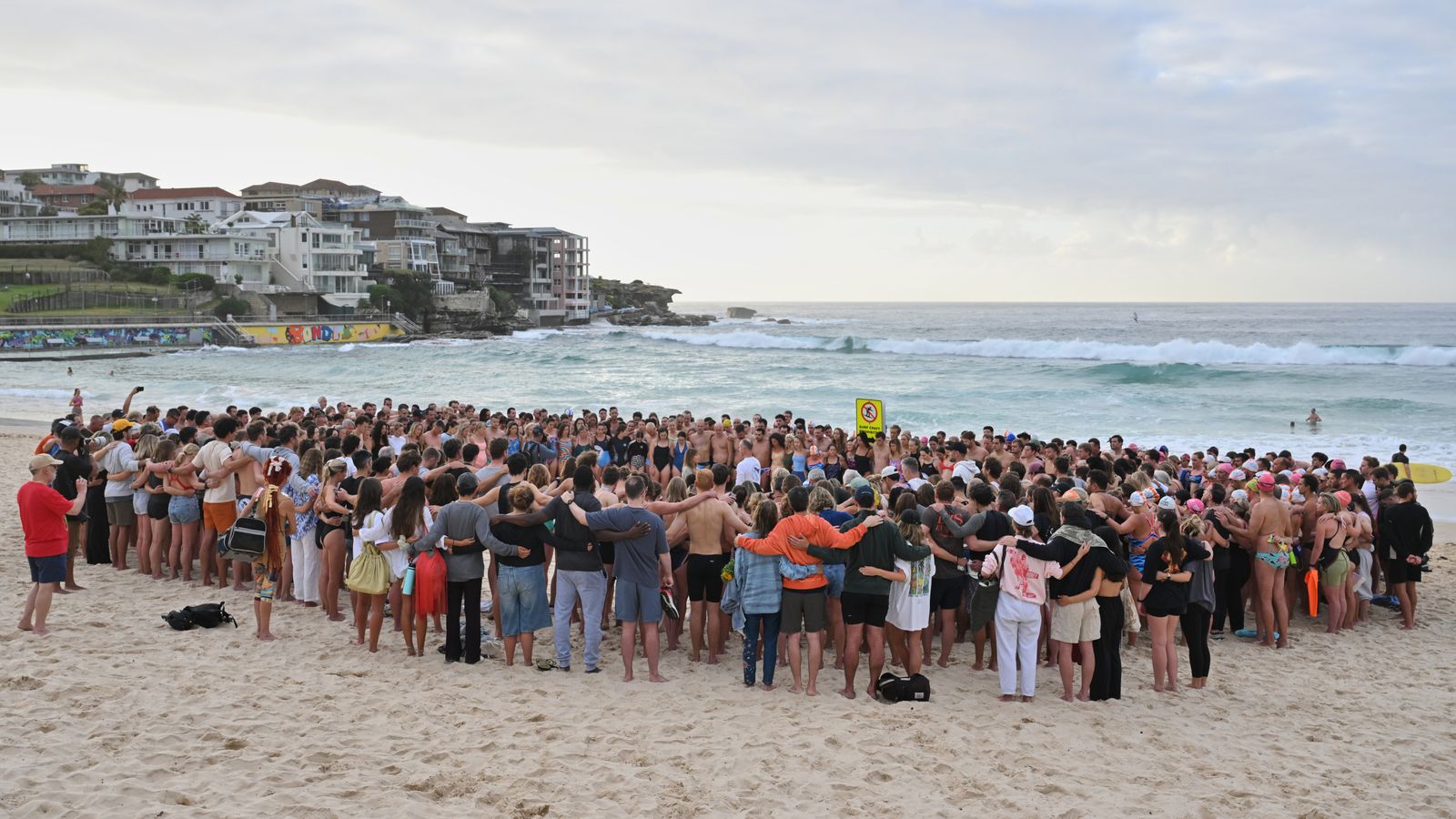Swimmers gather for a morning vigil in Sydney. Pic: AAP/AP